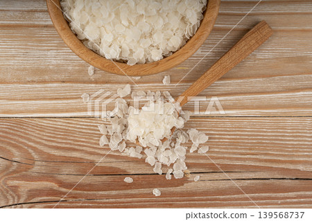 Raw flattened rice. Dry rice flakes or poha, Indian breakfast food Raw flattened rice. Dry rice flakes or poha, Indian breakfast food 139568737