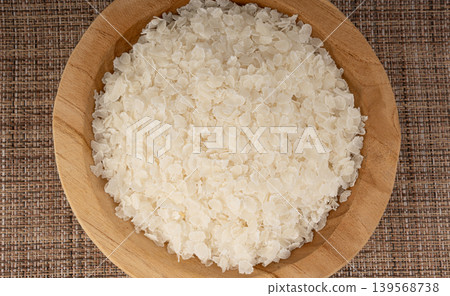 Raw flattened rice. Dry rice flakes or poha, Indian breakfast food Raw flattened rice. Dry rice flakes or poha, Indian breakfast food 139568738