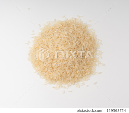 White parboiled rice grains. Dry uncooked ponni rice, small organic basmati White parboiled rice grains. Dry uncooked ponni rice, small organic basmati 139568754