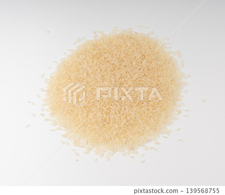 White parboiled rice grains. Dry uncooked ponni rice, small organic basmati White parboiled rice grains. Dry uncooked ponni rice, small organic basmati 139568755