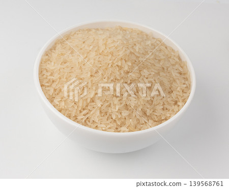 White parboiled rice grains. Dry uncooked ponni rice, small organic basmati White parboiled rice grains. Dry uncooked ponni rice, small organic basmati 139568761