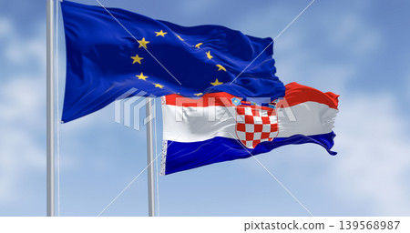 Flags of Croatia and the European Union fluttering together on a clear day Flags of Croatia and the European Union fluttering together on a clear day 139568987