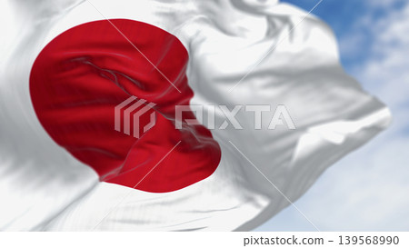 Japan national flag waving in the wind on a clear day Japan national flag waving in the wind on a clear day 139568990