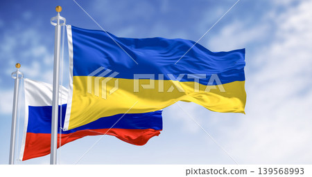 National flags of Ukraine and Russia waving on a clear day National flags of Ukraine and Russia waving on a clear day 139568993