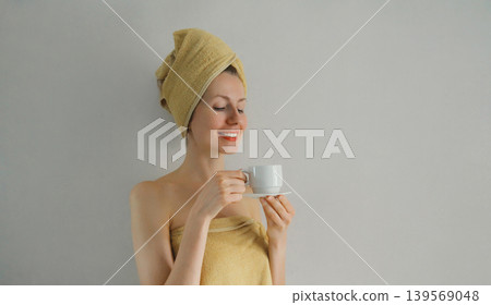 Happy woman enjoying with cup of coffee in the morning at home Happy woman enjoying with cup of coffee in the morning at home 139569048