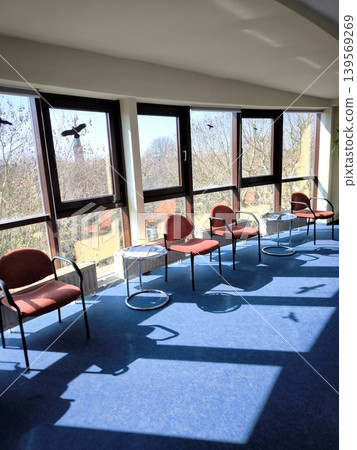A modern waiting area interior with panoramic windows. 139569269