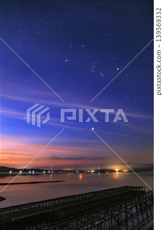 Summer starry sky over the Seto Inland Sea: Orion rising in the dawn sky. Summer starry sky over the Seto Inland Sea: Orion rising in the dawn sky. 139569332