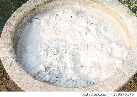 Calcium oxide on pot in farm Calcium oxide on pot in farm 139570179