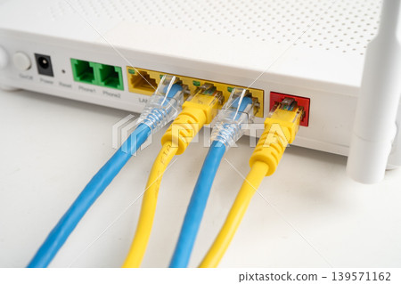 Ethernet cable with wireless router connect to internet service provider internet network. Ethernet cable with wireless router connect to internet service provider internet network. 139571162