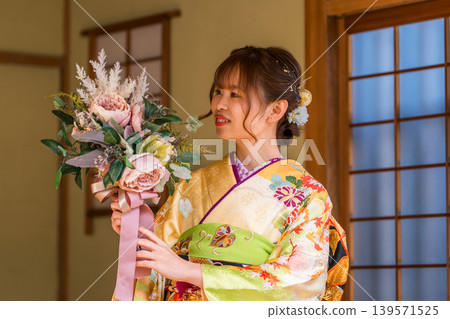 A young Japanese woman in a furisode kimono in a Japanese-style room (coming-of-age ceremony, 20th birthday celebration) A young Japanese woman in a furisode kimono in a Japanese-style room (coming-of-age ceremony, 20th birthday celebration) 139571525