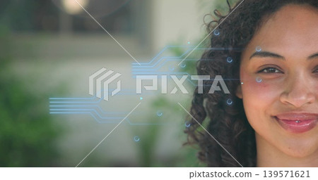 Smiling adult woman gazing in garden near light wall, with blue circuit overlay, copy space Smiling adult woman gazing in garden near light wall, with blue circuit overlay, copy space 139571621