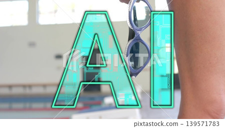 Standing mature swimmer in swimsuit holding goggles at poolside, showing turquoise AI, copy space 139571783