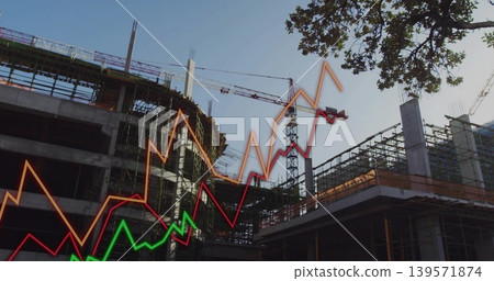 Showing concrete frame rising at construction site with scaffolding, cranes, graphs, tree right 139571874