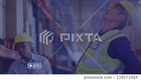 Inspecting supervisor leaning back, looking up in warehouse, wearing lime vest and hard hat, UI 619 Inspecting supervisor leaning back, looking up in warehouse, wearing lime vest and hard hat, UI 619 139571904