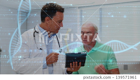 Examining doctor in coat, stethoscope and patient in polo viewing tablet in clinic, DNA graphics Examining doctor in coat, stethoscope and patient in polo viewing tablet in clinic, DNA graphics 139571961