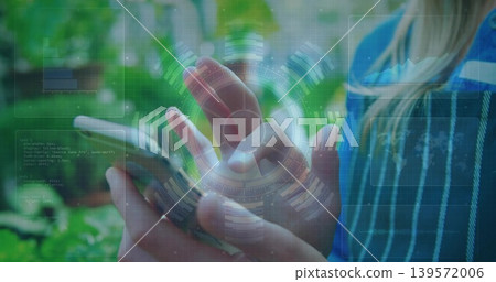 Holding smartphone, woman hovering finger over screen at balcony with AR HUD and striped blue top 139572006
