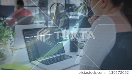 Working woman in dark top focusing on laptop with code dashboard at open-plan office, copy space Working woman in dark top focusing on laptop with code dashboard at open-plan office, copy space 139572062