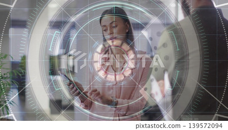 Framing woman in light pink blouse tapping smartphone at modern office, with HUD overlay and tablet Framing woman in light pink blouse tapping smartphone at modern office, with HUD overlay and tablet 139572094