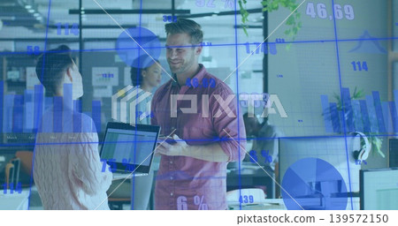 Talking man in mauve shirt with tablet, briefing coworker with laptop in open office, data overlay 139572150