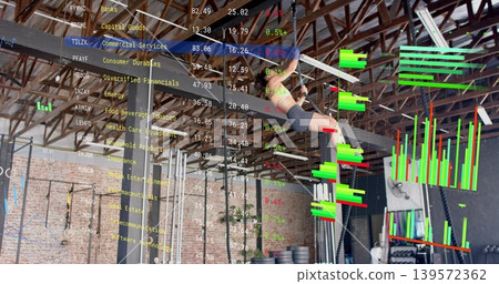 Hanging athlete in sportswear gripping bar on metal rig at gym, with financial overlay, copy space Hanging athlete in sportswear gripping bar on metal rig at gym, with financial overlay, copy space 139572362