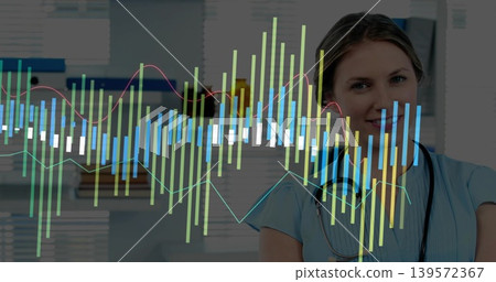 Smiling nurse in light blue scrubs monitoring data overlay at clinic, with stethoscope, copy space Smiling nurse in light blue scrubs monitoring data overlay at clinic, with stethoscope, copy space 139572367