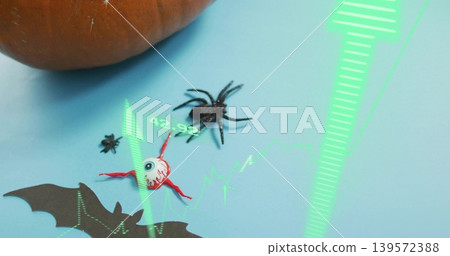 Displaying spooky scene on pale blue sheet showing eyeball black spider pumpkin green AR bat cutout Displaying spooky scene on pale blue sheet showing eyeball black spider pumpkin green AR bat cutout 139572388