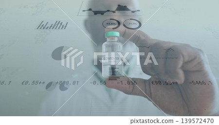 Showing scientist wearing PPE, gloved hand holding teal-capped COVID-19 vial in lab, data overlays 139572470