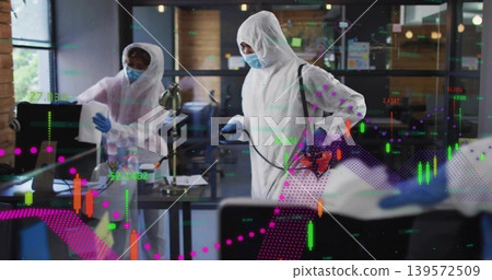 Spraying man in white suit aiming orange backpack sprayer at office desk with market charts Spraying man in white suit aiming orange backpack sprayer at office desk with market charts 139572509