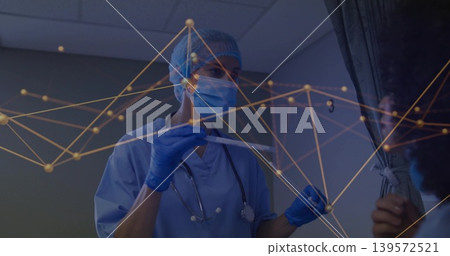 Showing nurse in blue scrubs mask gloves cap holding swab in exam room, stethoscope node graphic Showing nurse in blue scrubs mask gloves cap holding swab in exam room, stethoscope node graphic 139572521