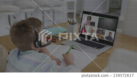 Writing child wearing headset, light top sitting at study corner, with laptop and green pencil Writing child wearing headset, light top sitting at study corner, with laptop and green pencil 139572617