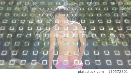 Running shirtless Asian man laughing, passing through park sprinkler, wearing pink trunks, grid Running shirtless Asian man laughing, passing through park sprinkler, wearing pink trunks, grid 139572801