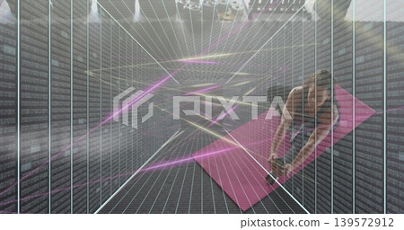 Bending woman in sportswear reaching for weight on pink mat amid server racks neon-grid, copy space Bending woman in sportswear reaching for weight on pink mat amid server racks neon-grid, copy space 139572912