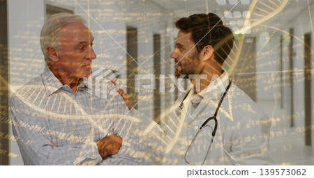 Comforting clinician in lab coat placing hand on senior in clinic corridor, stethoscope DNA overlay Comforting clinician in lab coat placing hand on senior in clinic corridor, stethoscope DNA overlay 139573062