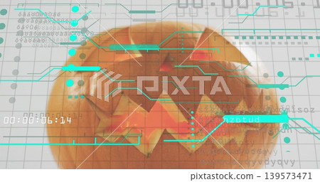 Glowing carved orange pumpkin sitting on white grid sheet, showing teal HUD overlays and timestamp Glowing carved orange pumpkin sitting on white grid sheet, showing teal HUD overlays and timestamp 139573471