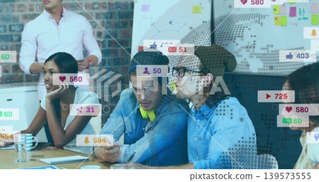 Discussing team of five in casual wear planning in office, with smartphone, whiteboard social icons Discussing team of five in casual wear planning in office, with smartphone, whiteboard social icons 139573555