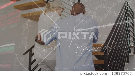 Adult man blue shirt supporting senior woman white blouse climbing wooden stairs at home with HUD 139573763