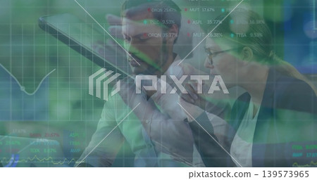 Analyzing business team reviewing stock-grid overlay in meeting room, with tablet, blazers, glasses Analyzing business team reviewing stock-grid overlay in meeting room, with tablet, blazers, glasses 139573965