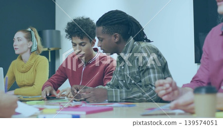 Sorting two men in red sweater and green plaid arranging index cards at table, sticky notes Sorting two men in red sweater and green plaid arranging index cards at table, sticky notes 139574051