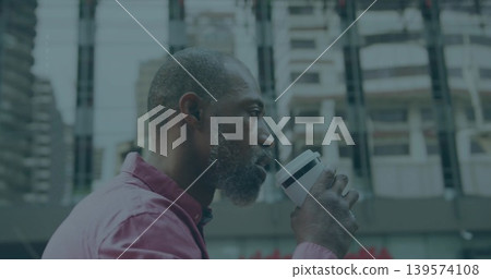 Drinking mature man holding white travel coffee cup on city plaza, pink shirt, copy space Drinking mature man holding white travel coffee cup on city plaza, pink shirt, copy space 139574108