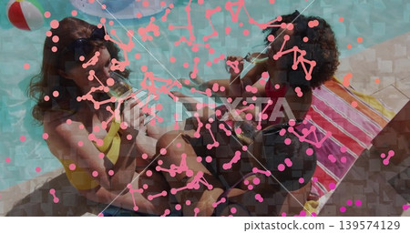 Sitting three women drinking at pool edge wearing swimsuits denim shorts beach ball pink overlay Sitting three women drinking at pool edge wearing swimsuits denim shorts beach ball pink overlay 139574129