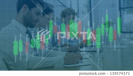 Writing team wearing business attire reviewing papers at meeting, using laptop with chart overlay Writing team wearing business attire reviewing papers at meeting, using laptop with chart overlay 139574371