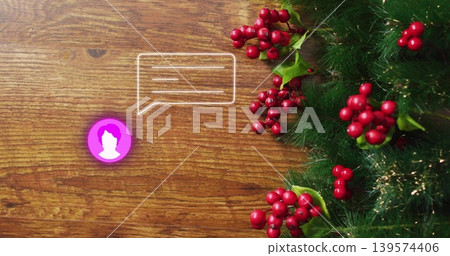 Showing green garland with red berries and tinsel on wood desk, purple avatar chat-icon, copy space Showing green garland with red berries and tinsel on wood desk, purple avatar chat-icon, copy space 139574406
