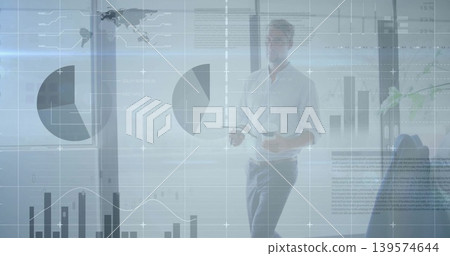 Walking male presenter in business-casual shirt holding coffee cup and remote with charts on glass Walking male presenter in business-casual shirt holding coffee cup and remote with charts on glass 139574644