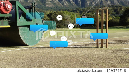 Sitting green field roller on left of cricket pitch, showing stumps and chat bubbles, copy space Sitting green field roller on left of cricket pitch, showing stumps and chat bubbles, copy space 139574748