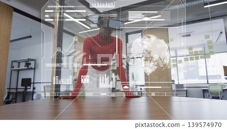 Presenting woman wearing red top, AR headset, showing HUD panels over wooden table in office Presenting woman wearing red top, AR headset, showing HUD panels over wooden table in office 139574970