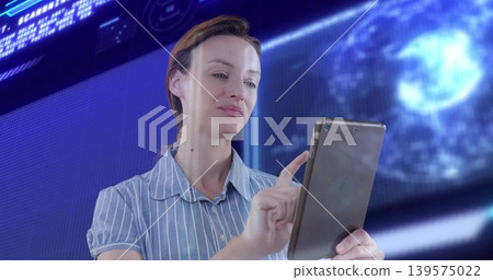 Holding mid-adult woman in striped blouse using tablet in tech room, globe display and light streak Holding mid-adult woman in striped blouse using tablet in tech room, globe display and light streak 139575022