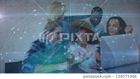 Collaborating team reviewing laptop in office, woman in wide hat white blouse, network overlay 139575366