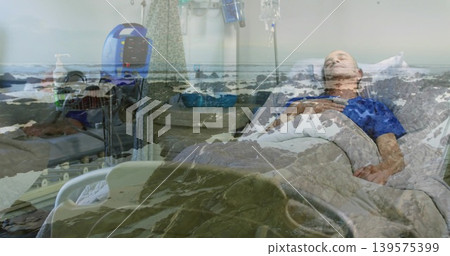 Lying male patient in blue gown receiving IV fluids in hospital room, with shoreline overlay Lying male patient in blue gown receiving IV fluids in hospital room, with shoreline overlay 139575399