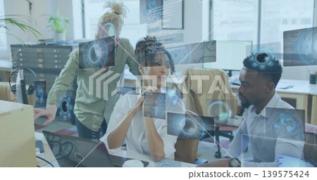 Discussing team leaning and gesturing in modern office, with laptop, screens, HUD, wearing shirts Discussing team leaning and gesturing in modern office, with laptop, screens, HUD, wearing shirts 139575424