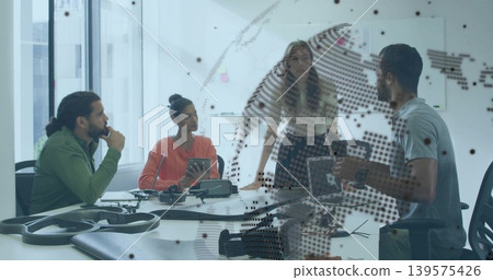 Discussing drone, four colleagues in work clothes leaning over table in meeting room with laptop Discussing drone, four colleagues in work clothes leaning over table in meeting room with laptop 139575426